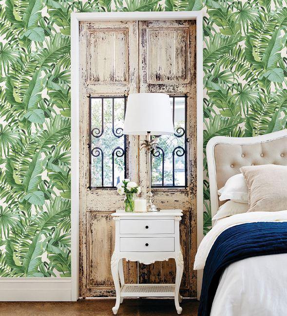 Wallpaper with tropical palm trees in a bedroom